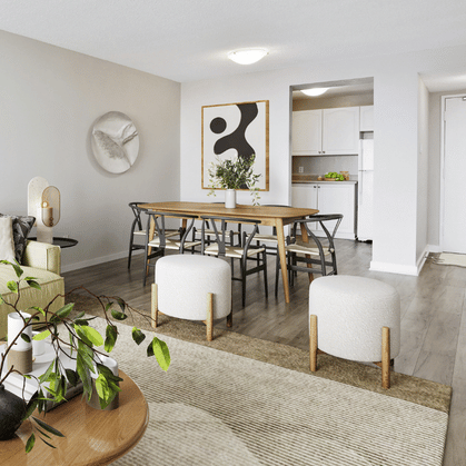 Open-concept living and dining room in a suite at The Aventura.